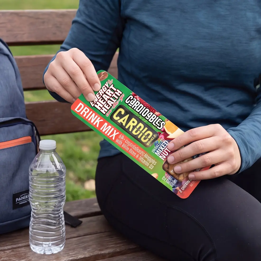 Opening a Cardioables pack on a park bench