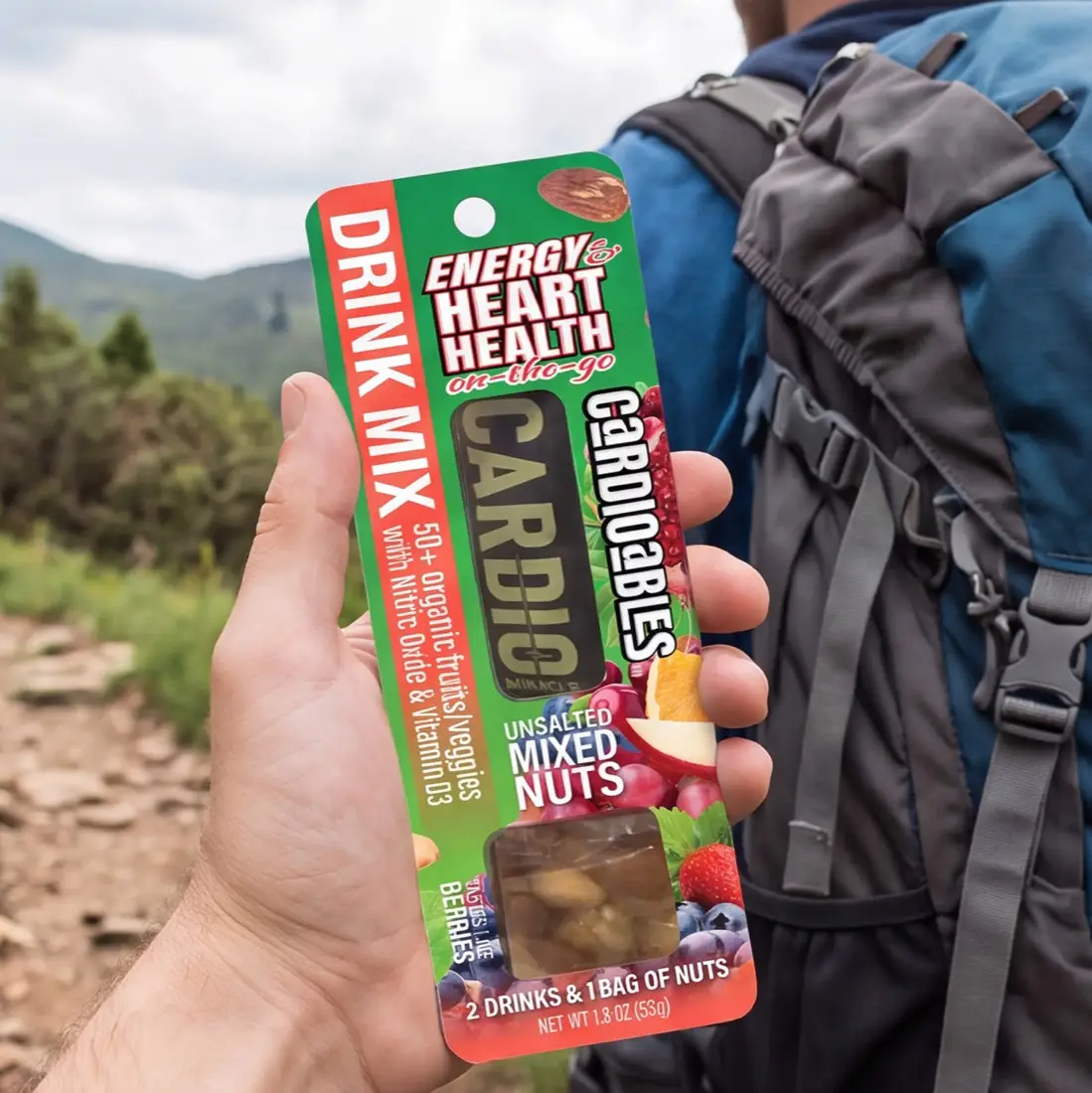 Holding a Cardioables pack on a hiking trail